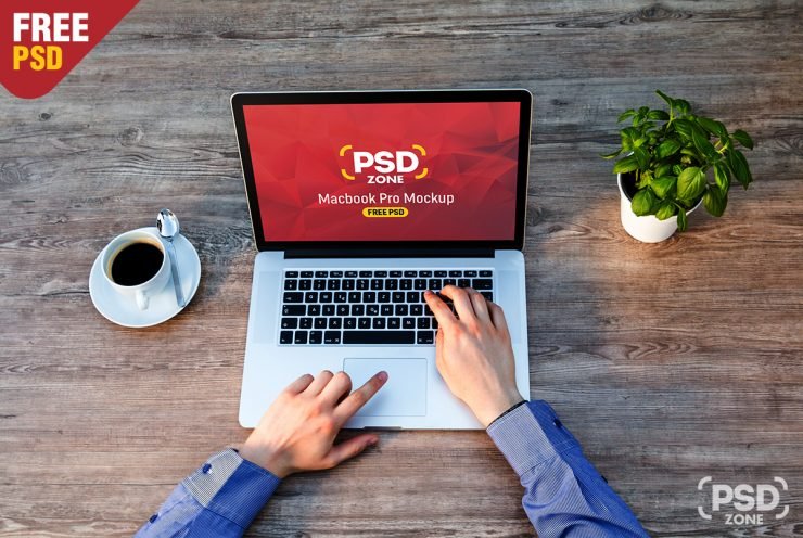 Man Working on Macbook Mockup Free PSD