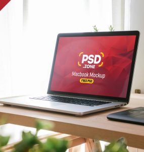 Macbook Pro on Wooden Table Mockup PSD