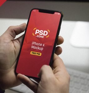 iPhone X in Hand Mockup PSD