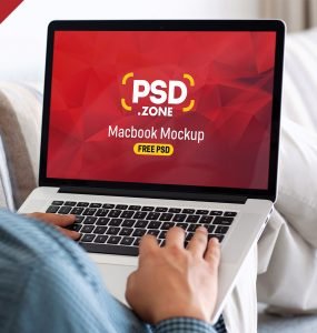 Man Typing on Macbook Pro Mockup PSD