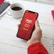 Holding iPhone X Mockup PSD