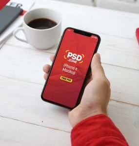 Holding iPhone X Mockup PSD
