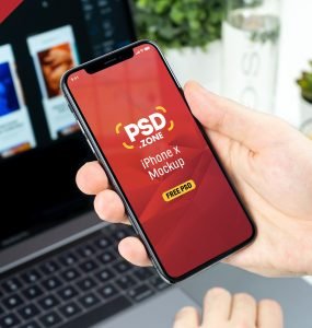 Man Holding iPhone X Mockup PSD